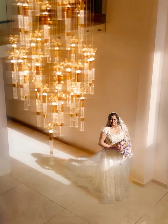 Stepping into a season of abundant blessings. ✨ Surrounded by golden light and the sweet presence of her flower girls, she is the picture of a radiant bride. @yourstory.films , we live for these breathtaking, cinematic glimpses of a beautiful journey beginning. 🕊️🤍

Let us capture the elegant details of your blessed day.

[ChristianWeddingPhotography,FineArtWedding,HolyMatrimony,WeddingDayDetails,CinematicVideography, WeddingPhotographer]